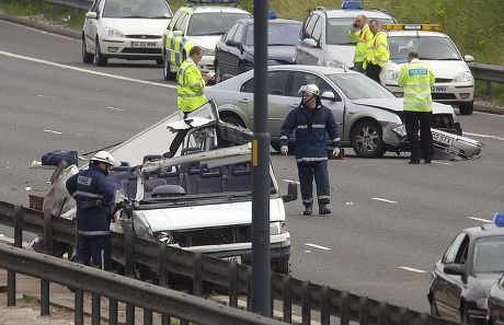 Emergency Services Respond To M56 Overturn: Motorway Closure And Casualty Treatment Emergency Services Respond To M56 Overturn: Motorway Closure And Casualty Treatment